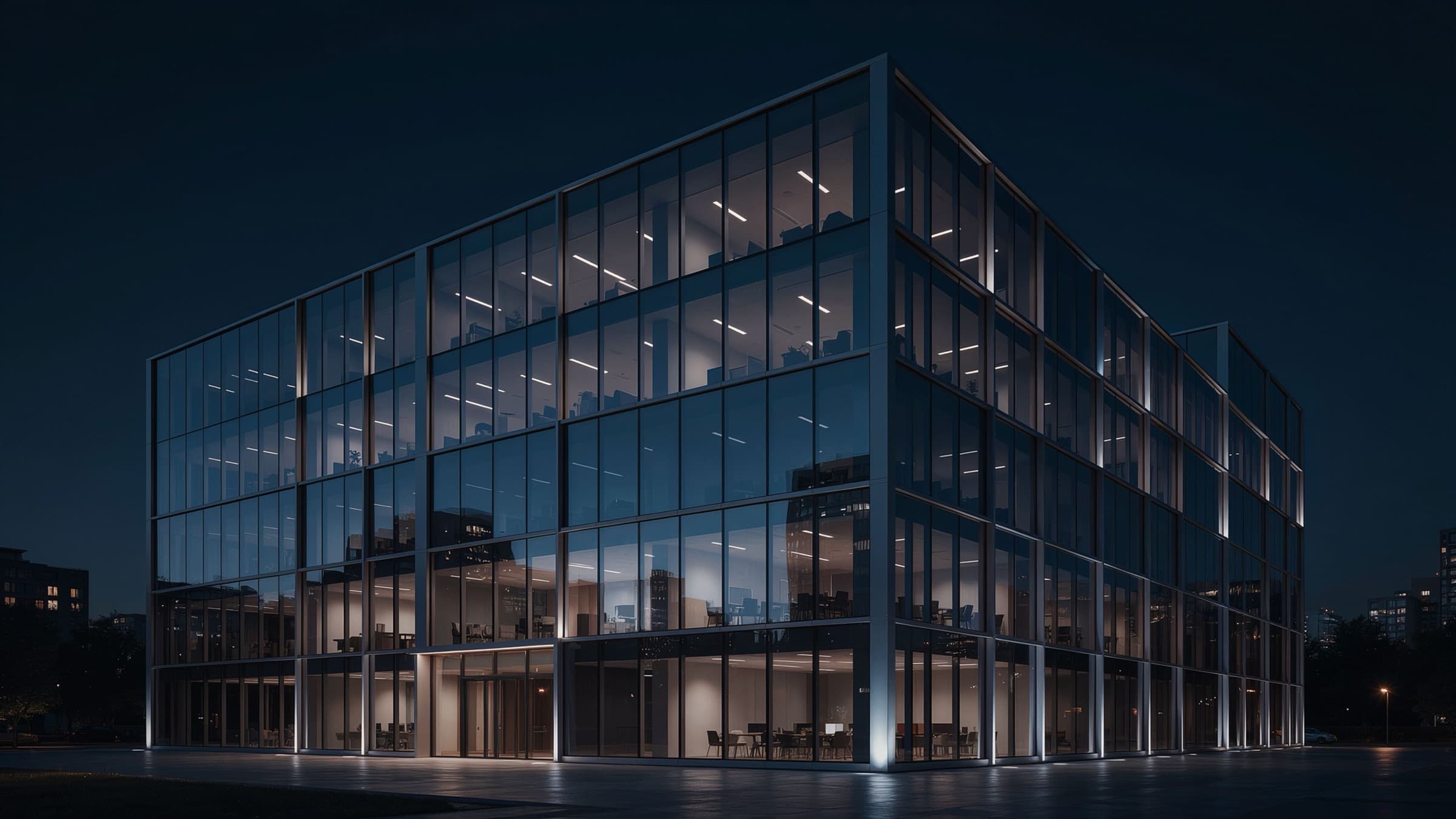 Glass office building at night with its floors lit